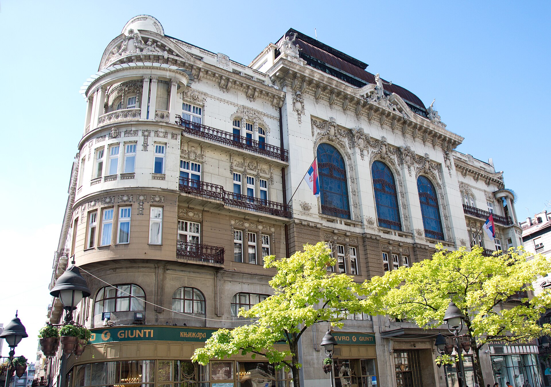 Ornate facade of the Academy of Sciences and Arts in Belgrade with arched windows and balconies