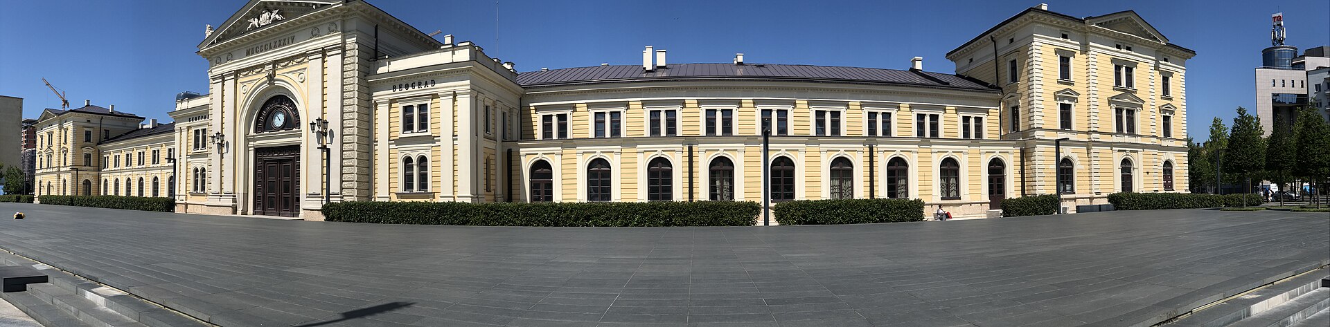 Restored Old Main Station building with a clocked entrance and symmetrical wings in Belgrade