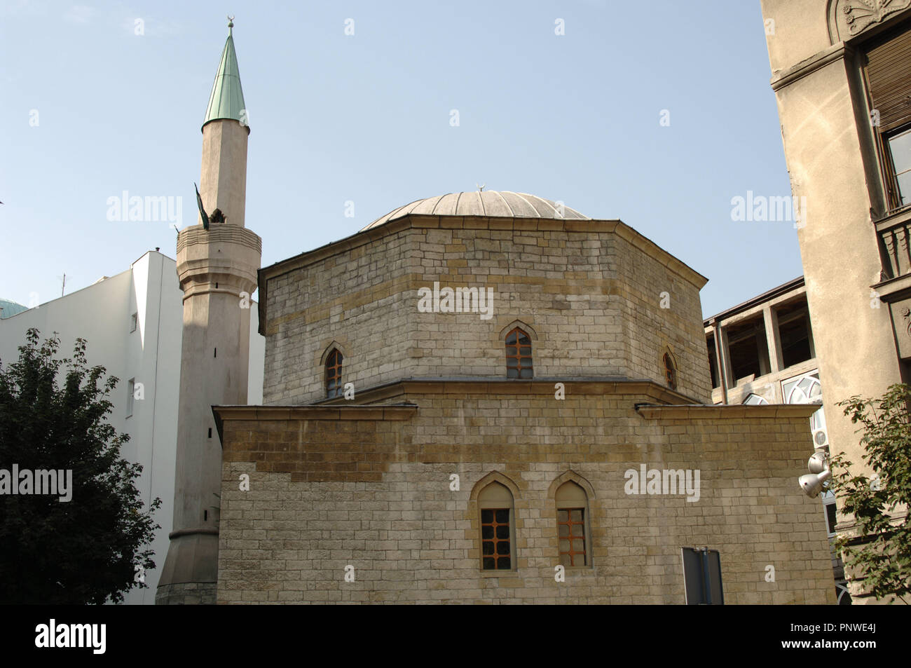 Stone Bajrakli Mosque with a slender minaret and small windows in Belgrade