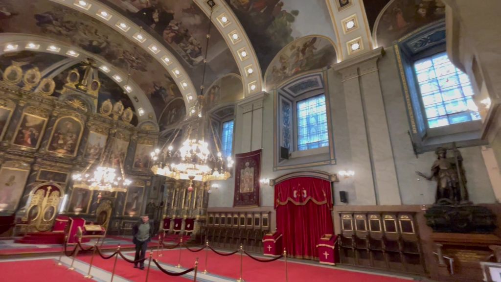 Gold-plated iconostasis and wall paintings by Dimitrije Avramovic inside the cathedral