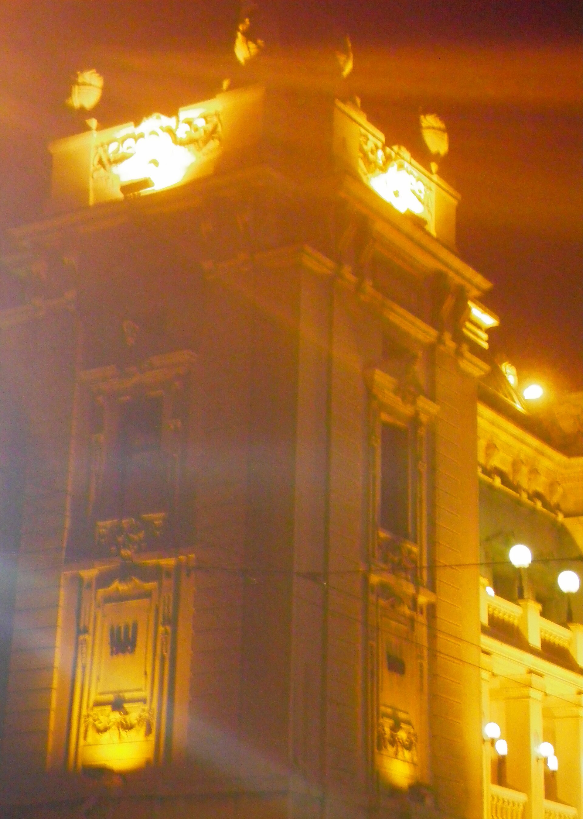 Illuminated corner facade of the National Theatre in Belgrade at night