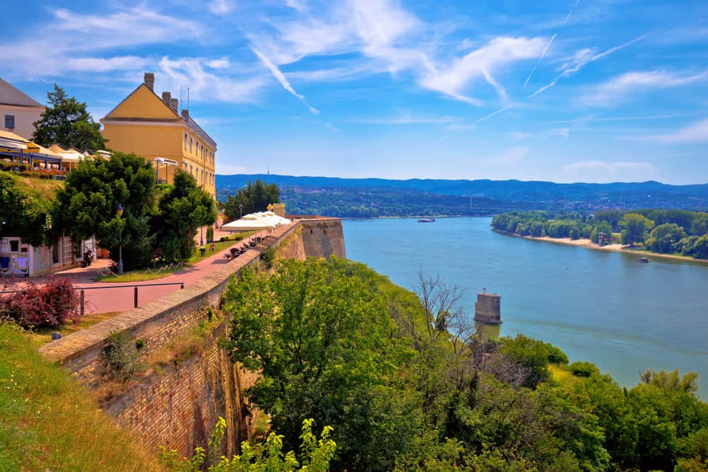 Fortress terraces above the Danube near Novi Sad, with river bends, trees, and distant hills