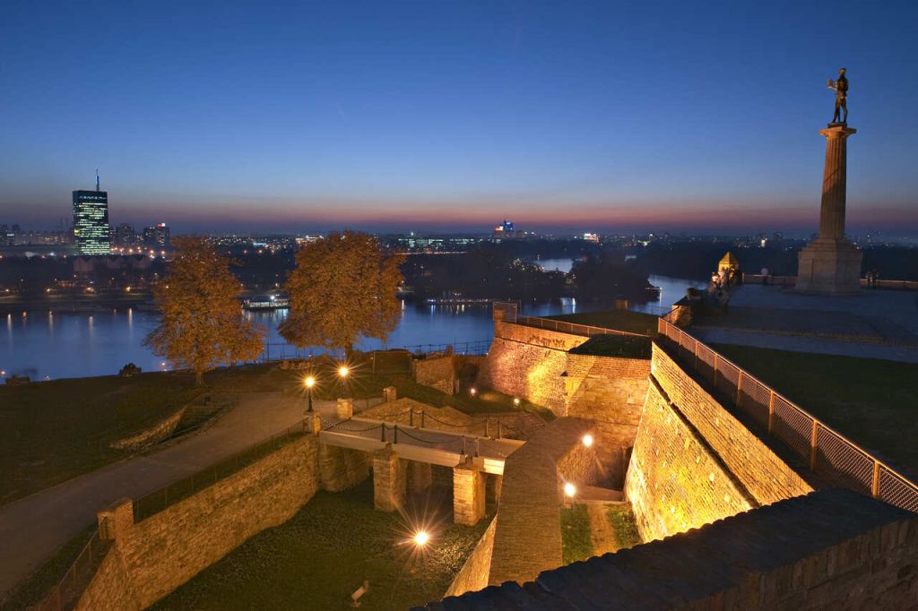 Kalemegdan Fortress at dusk with the Pobednik monument overlooking the Danube in Belgrade, Serbia
