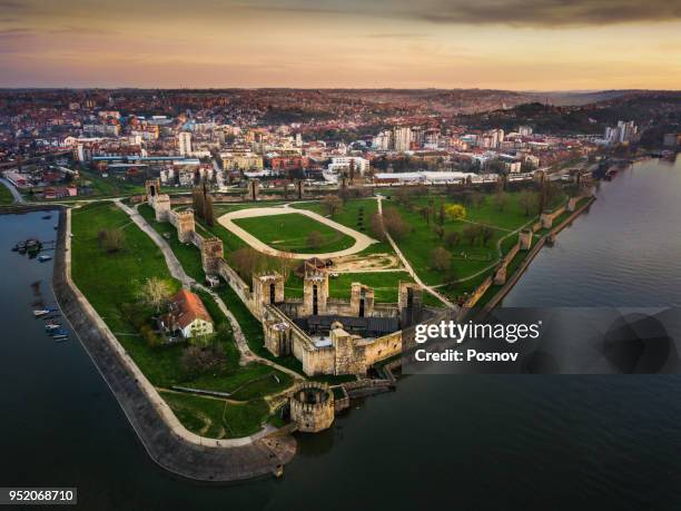 Aerial view of Smederevo Fortress beside the Danube with city buildings behind it