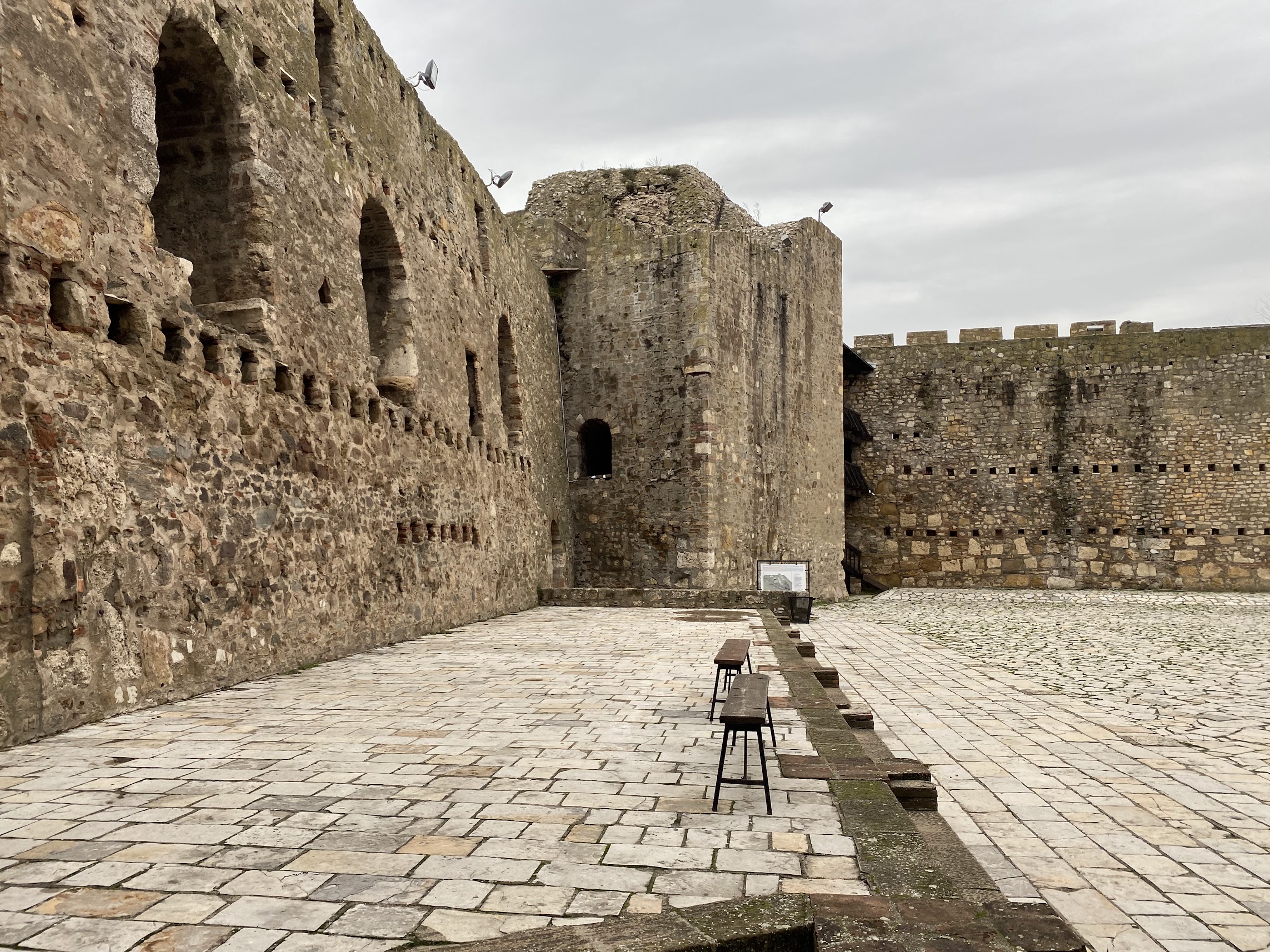 Stone fortress walls and paved courtyard inside Smederevo Fortress in Smederevo