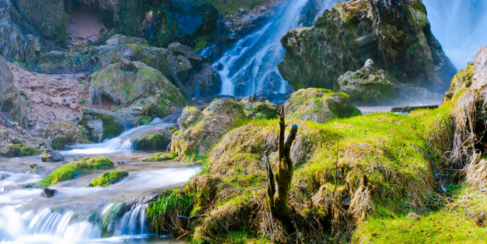 Gostilje waterfall cascading through forest