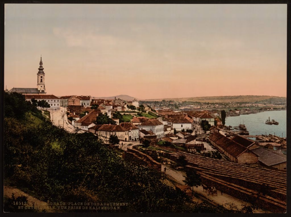 Belgrade cathedral above rooftops and riverfront, seen from Kalemegdan at dusk
